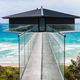 Image for article titled This Cool Coastal House Looks Like It's Floating Over The Ocean